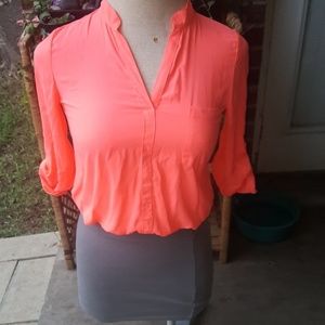 The grey skirt and pink long sleeve